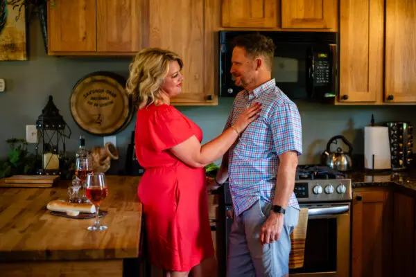 Couple with woman on man's chest in Creole Cabin Kitchen