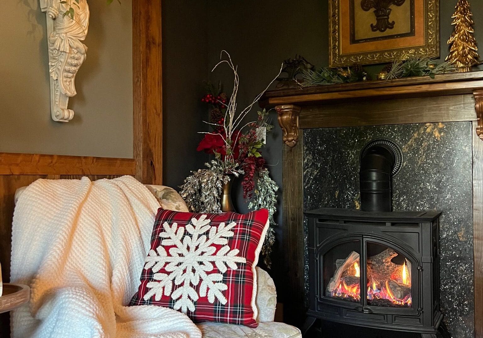 Cozy fireplace corner with chair and a throw